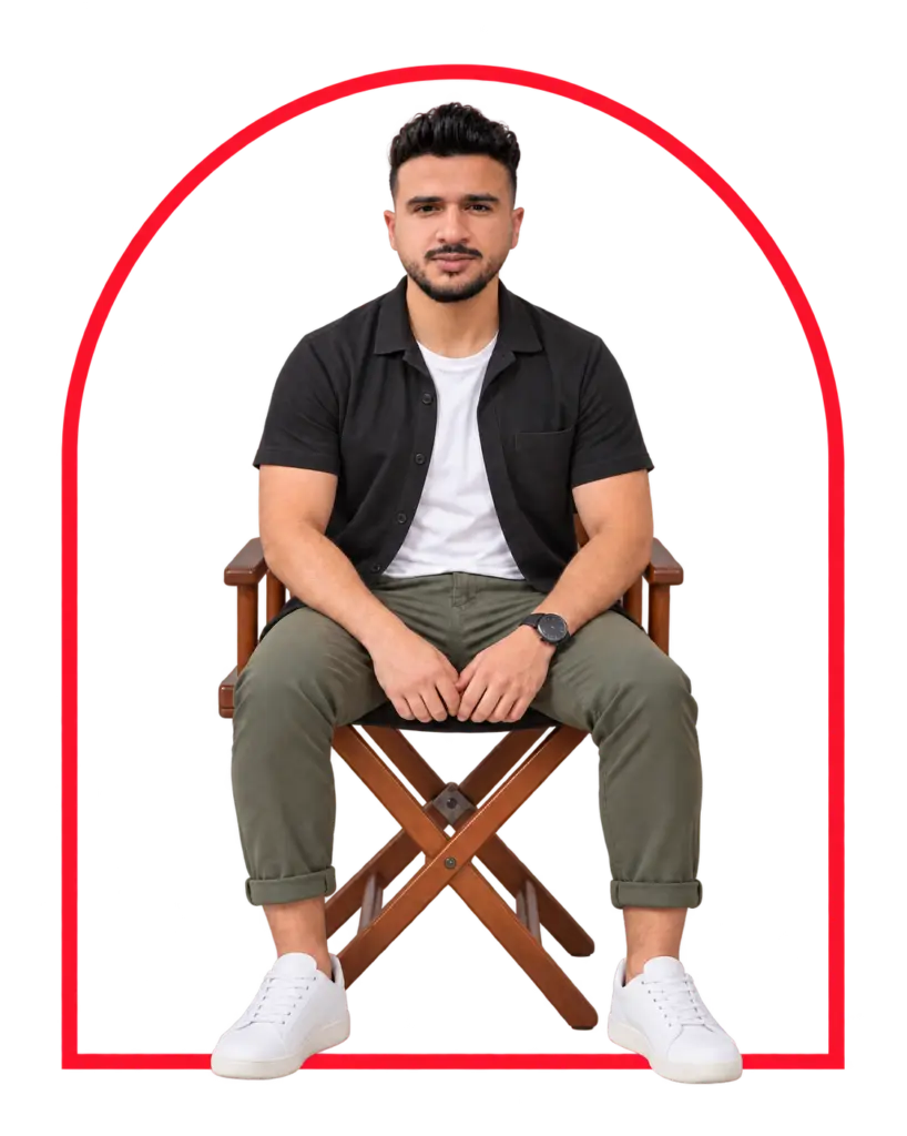 Ahmed Abdelgaber seated on a director's chair